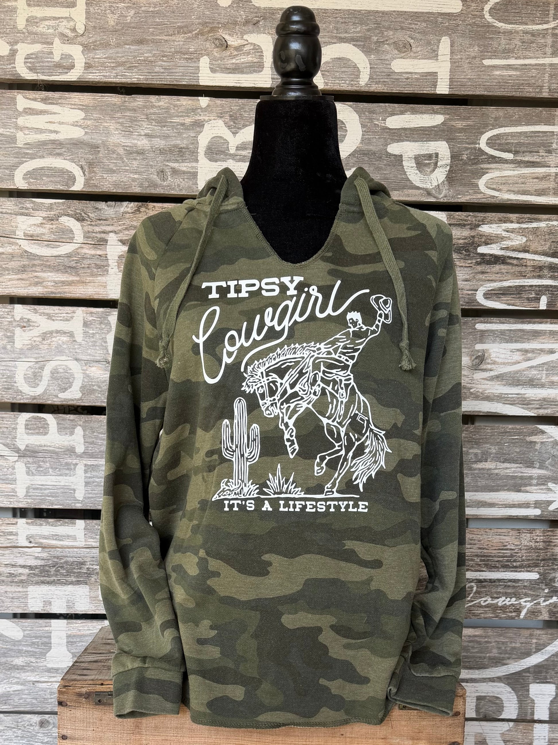 Tipsy Cowgirl Lifestyle green camo V-neck hoodie with white bucking bronc western graphic