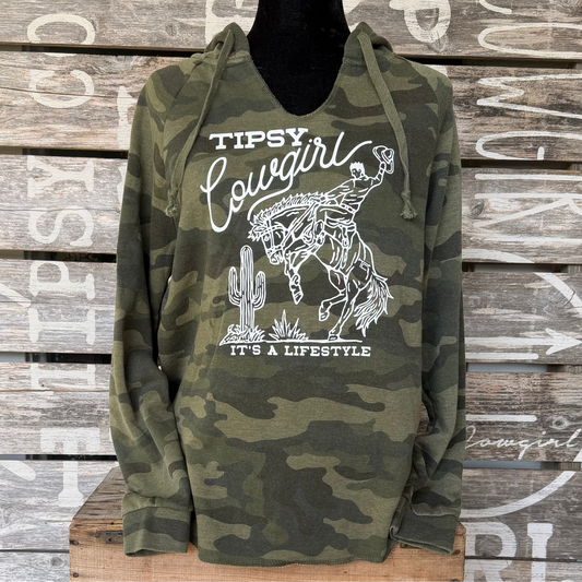 Tipsy Cowgirl Lifestyle V-Neck Hoodie in green camo featuring white bucking bronc western graphic and It’s a Lifestyle design