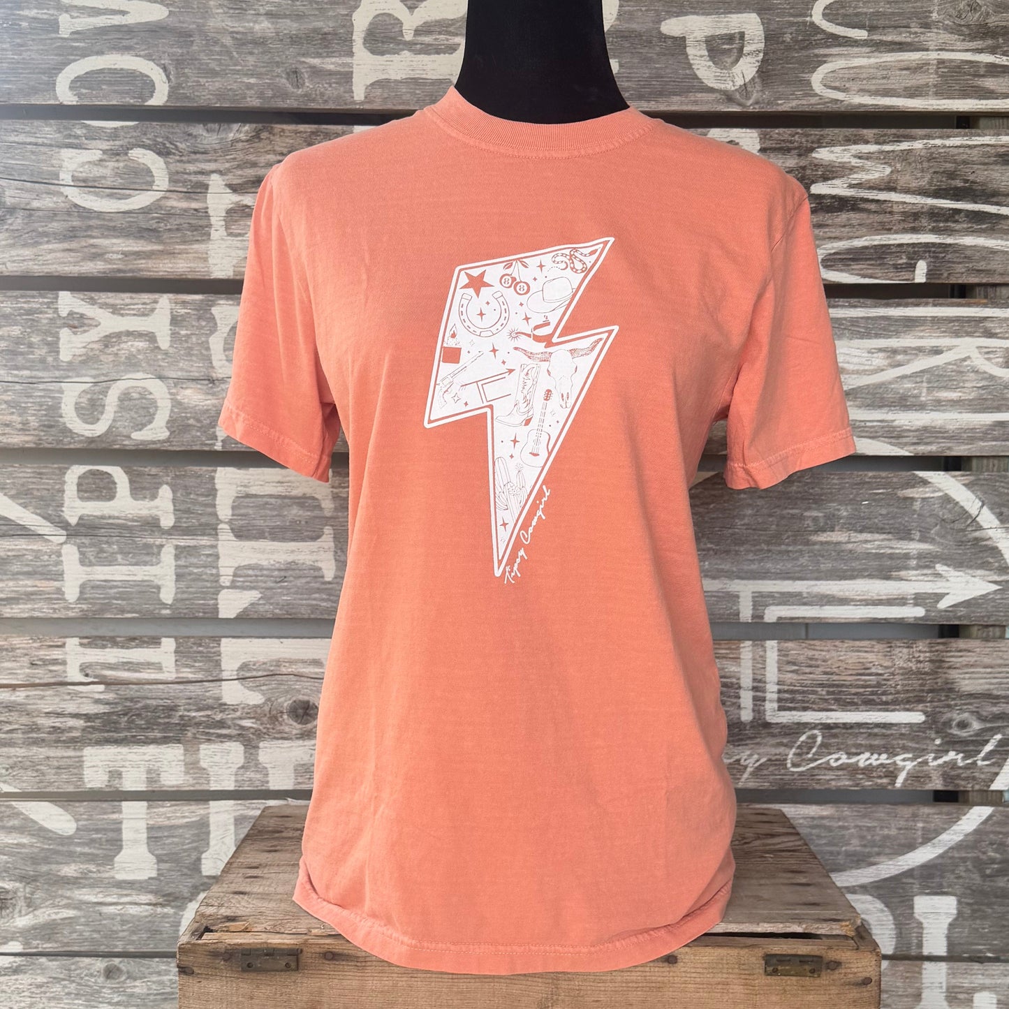 Tipsy Cowgirl Electric West Tee in Terracotta featuring white western lightning bolt graphic