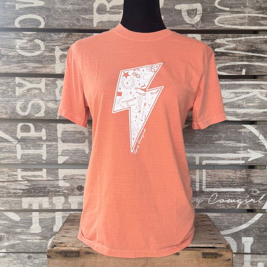 Tipsy Cowgirl Electric West Tee in Terracotta featuring white western lightning bolt graphic