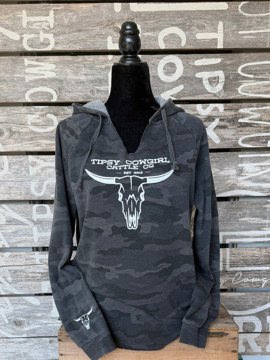 Tipsy Cowgirl Cattle Co. black camo V-neck hoodie with white longhorn skull western graphic and sleeve detail